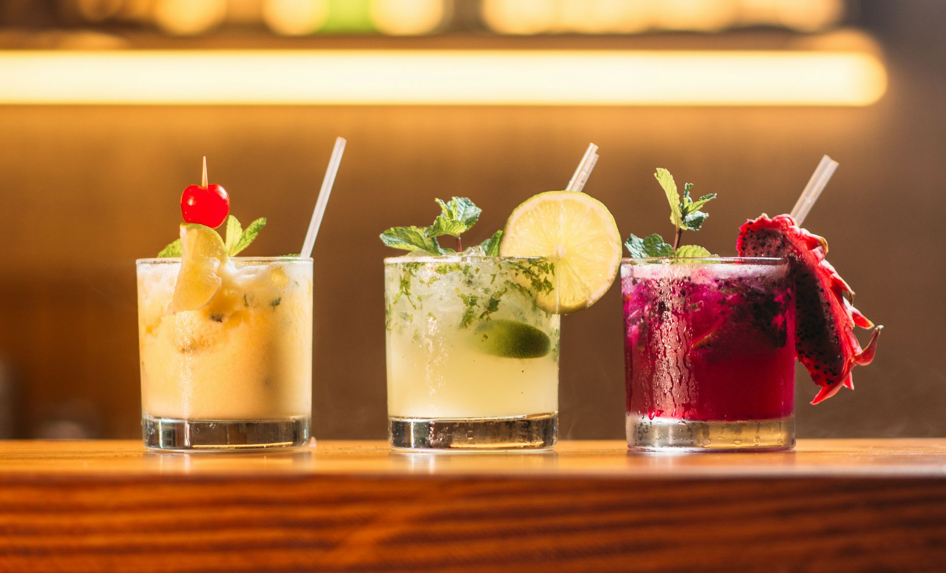 three clear glass cups with juice